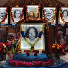 Our main altar, decorated with garlands of roses and illuminated with soft light. This is the spiritual heart of our temple, where we focus our devotion on Paramhansa Yogananda and the masters who guide us.