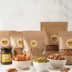 This shows the variety you can include in a custom hamper. Choose from different savoury snacks like kodbale and chekkalu, crunchy peanuts, and my special homemade chutneys to create the perfect gift.