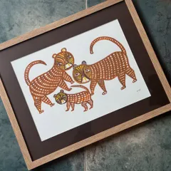 This framed Bhil art piece depicts a family of tigers, rendered in the traditional style with natural dyes. By bringing these pieces into our homes, we are not just decorating a wall; we are helping keep these art forms alive.