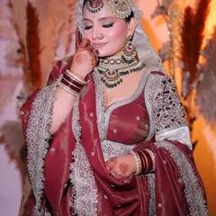 A candid moment from my bridal shoot. The makeup was set to be flawless from every angle, with a soft blush and perfectly defined features.