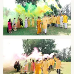 A grand entrance at a Haldi ceremony. The couple walks through a cloud of colorful smoke held by their friends and family, creating a spectacular and memorable photo.