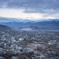 The city of Leh as seen from above during my winter trip. The entire valley is painted in muted winter tones, with the snow-capped Stok range looming in the distance.