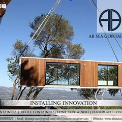 Beyond logistics, I deliver innovation by fabricating custom container structures. Here, a crane installs a modern, modular container home, showcasing how I turn a client's vision for a portable office, shop, or living space into a tangible, high-quality reality.