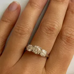 Three diamonds, one timeless story. This elegant ring is designed to celebrate your past, embrace your present, and shine brightly into your future. It is a symbol of a love that grows and lasts forever, captured on a simple, polished band.