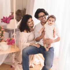 A modern family portrait session featuring our rustic swing and bougainvillea setup. The light, airy feel and genuine smiles make this a perfect representation of a happy, contemporary family.