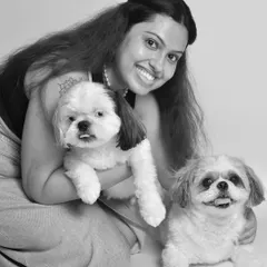 Two adorable Shih Tzus and their loving mom. This black and white studio portrait is full of smiles and happy little faces, a perfect tribute for Mother's Day.