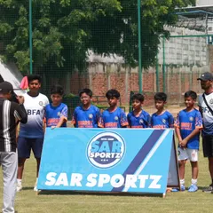 Pride in the jersey, power in the team. One of our squads posing for a team photo before a tournament.