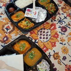 This is a sample of my homestyle lunch thali, perfect for corporate orders or events. This particular meal includes shahi paneer, dal, mix veg, chole, jeera rice, roti, and a gulab jamun, offering a complete and satisfying 'ghar ka khana' experience.