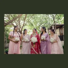 A classic portrait of the bride with her bridesmaids, all smiles and holding their bouquets. A beautiful memory of the women who stood by her side.