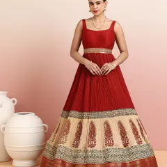 I designed this floor-length gown as a seamless blend of traditional motifs and contemporary form. The rich red pleated bodice flows into a beige skirt adorned with classic paisley embroidery, making it an elegant choice for receptions and formal evening soirées.