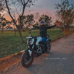 Arms outstretched, embracing the freedom and the beautiful evening sky during a ride through the countryside. This is what riding is all about.