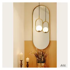 The reflection in the mirror doubles the impact of the stylish pendant light. This is a simple technique we use to enhance brightness and add depth to smaller spaces like foyers.
