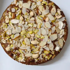 This is my Whole Wheat Jaggery Cake, and it's pure indulgence without the guilt. It's loaded with a generous amount of mixed nuts like almonds and pistachios, making it a perfect diabetic-friendly treat.
