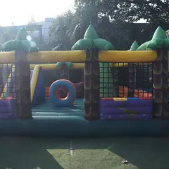 My jungle-themed bouncy castle is a large inflatable structure with obstacles and a slide, ideal for bigger events and outdoor spaces. It's safely enclosed with netting for worry-free play.