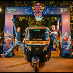 The story of an event includes the fun, candid moments. This shot with the auto-rickshaw adds a uniquely Mumbai flavor to the Red Bull event, making it feel authentic and grounded in the city's culture.