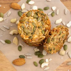 A close-up view of my 7-Seeds Nuts Cookies on parchment paper. You can see the rich texture and the abundance of nuts and seeds baked into every single cookie.