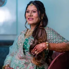 A candid moment of joy. Her radiant smile and glowing makeup perfectly capture the happiness of this special milestone.