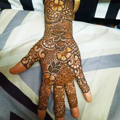 A beautiful and dense floral design covering the back of the hand. I used a mix of roses and other flowers, connected by leafy vines, to create this lush pattern.