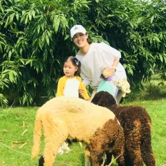 A mother and daughter enjoying a moment with our sheep. Feeding the animals is a highlight for many of our young visitors, teaching them kindness and respect for other living beings.