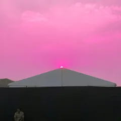 This experimental shot pushes color to the extreme, creating a surreal, vibrant pink sky for a minimalist composition.