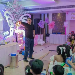 The start of our "mad science" show, where the entertainer engages the audience before diving into some spectacular experiments. It's fun and educational!