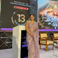 At the podium, ready to command the stage for the 13th edition of the DJGF International Jewellery Exhibition.