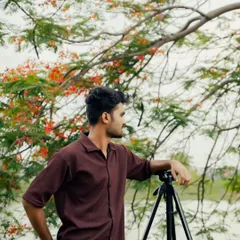 Here I am, setting up for a shot by the water. I'm always searching for the perfect light and location, whether it's in the city or out in nature.