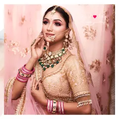 This dreamy bridal look combines a soft pink lehenga with a statement Polki and emerald choker. I added a delicate sheeshphool and nath to complete this blend of tradition and glamour.
