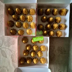 Boxes of Besan Modaks ready for Ganpati orders. Roasting the besan is a lengthy process, but the delicious outcome is worth it.
