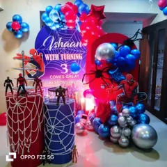 A Spiderman theme that's sure to be a hit with your little superhero. This dynamic setup features a web-slinging backdrop, character action figures, and bold red and blue balloon arrangements for an action-packed third birthday.