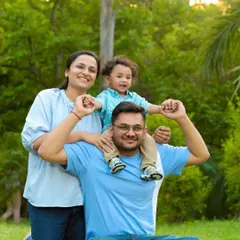 A classic family pose, perfect for an outdoor setting. Having the little one on dad's shoulders always results in big smiles and a fun, relaxed portrait.