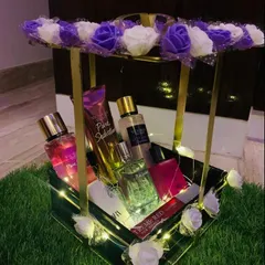 For the one who loves luxury, I create elegant fragrance hampers like this one. This beautiful metal and floral basket is filled with a curated selection of perfumes and body mists from brands like Victoria's Secret and Zara, making it a perfect gift for birthdays or anniversaries.
