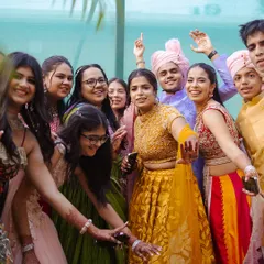 The joy of a Baraat is in the shared celebration. Here, friends and family of the groom take over the streets, dancing with pure energy and happiness.