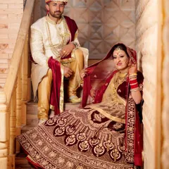 A royal portrait of the bride and groom in their stunning wedding attire. I use classic poses and settings like this staircase to create elegant and timeless wedding photographs.