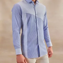 A well-made shirt is the foundation of a man's wardrobe. This piece, with its unique striped paneling, is designed to be versatile enough for the boardroom yet stylish enough for an evening soirée.