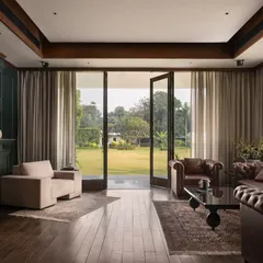 From the den of Mehalin Farm, the landscape becomes an extension of the living space. The design incorporates floor-to-ceiling glazing to frame the view and create a seamless transition between the curated interior and the natural exterior.