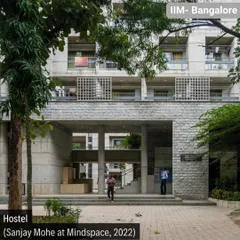 The entrance to the new hostel at IIM Bangalore, completed in 2022. We designed this entrance to be porous and inviting, using a blend of the campus's signature stone with modern exposed concrete to create a structure that respects its legacy while asserting its own identity.