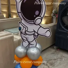 A standalone astronaut cutout prop on a balloon base, a great addition for photos at a space-themed party.