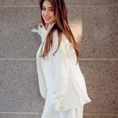 A happy client looking radiant in her custom white powersuit. Seeing the joy and confidence my clothes bring to you is why I do what I do.