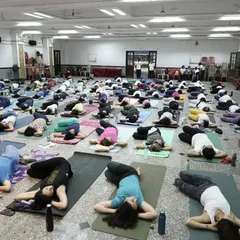 A moment of well-deserved Savasana (Corpse Pose) after our big community practice.