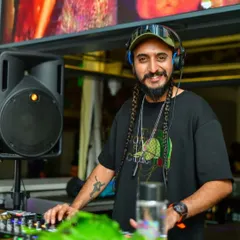 A calm moment behind the decks, with my headphones on, ready to mix. Music is a beautiful thing, and I let it flow through me.