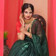 We can create traditional and elaborate sets in the studio, like this one with rich red curtains and antique-style furniture, perfect for an ethnic or bridal shoot.