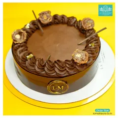 Indulge in my luxurious Ferrero Rocher cake. It has a smooth chocolate ganache finish, a border of rich chocolate cream, and is topped with whole Ferrero Rocher chocolates and flecks of edible gold leaf.