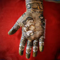 A tribute to a mother's love. This intricate design features a tender moment between a mother and her baby, capturing that unbreakable bond in a beautiful portrait.