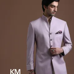 A classic bandhgala in a contemporary lilac hue. The clean lines, sharp tailoring, and asymmetrical button placket make this a standout piece. It is a modern interpretation of a timeless garment.