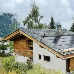 A closer look at the chalet redesign in Verbier, Switzerland, featuring a solar roof. This project was a rewarding challenge, balancing strict local building codes with our commitment to sustainable, modern mountain living.
