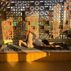 Sinking into a supported puppy pose during a restorative session. The goal here is to let go completely and allow the props to hold you.