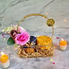 A closer look at my festive golden basket hamper. This option includes two jars of my tea cakes, adorned with traditional Bandhani and Bandhej fabric tops, and a 'Shubh Diwali' tag for that perfect festive touch.