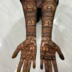 An elegant engagement design featuring traditional Indian architecture (jharokhas), lotus flowers, and elephants, covering the hands and forearms.