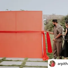 The anticipation builds. The setup for our car unboxing reveal features a large fabric wall that can be pulled away in a single, dramatic motion.